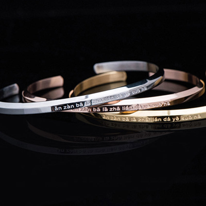 Om Mani Padme Hum Engraved Bracelet – four metal color cuffs stacked together, engraved bangle set