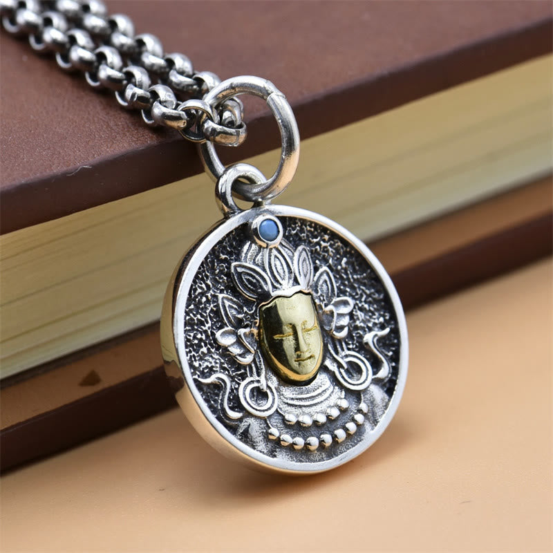 925 Sterling Silver Green Tara Necklace - Pendant on chain over stacked books, artisan crafted design