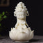 Kwan Yin Ivory Fruit Lotus Decoration - ivory-white chibi Guanyin on carved lotus base, dark background, Serene