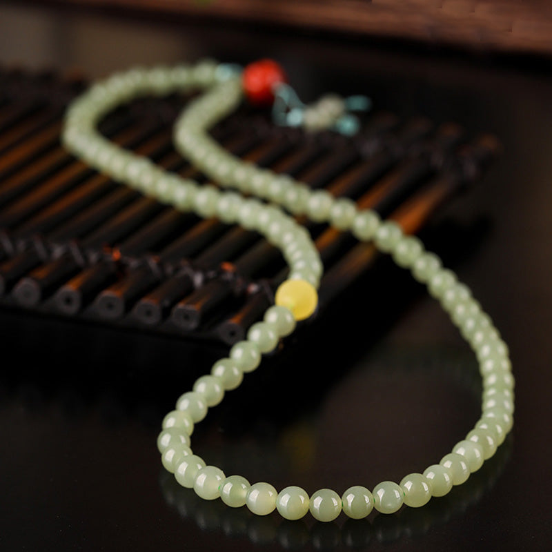 Jade Red Agate Prosperity Bracelet - Buddha carving macro detail, amber stone healing bracelet