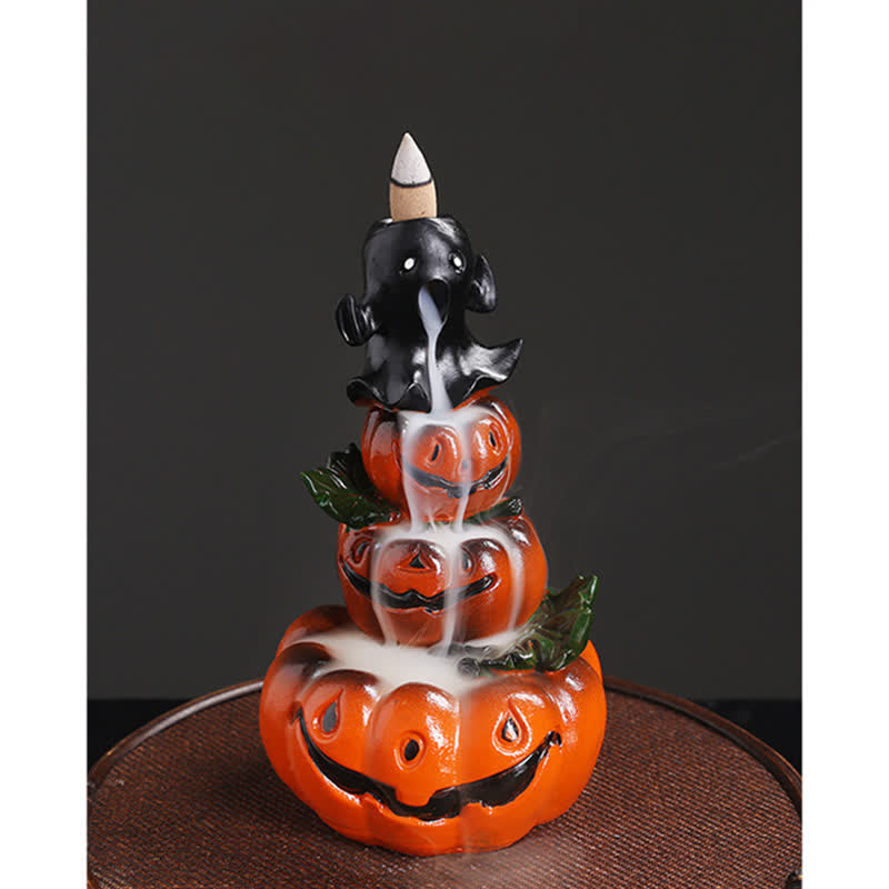 Front view of stacked pumpkin ghost backflow burner, dense white smoke flowing down through carved faces, dark backdrop – Halloween incense burner
