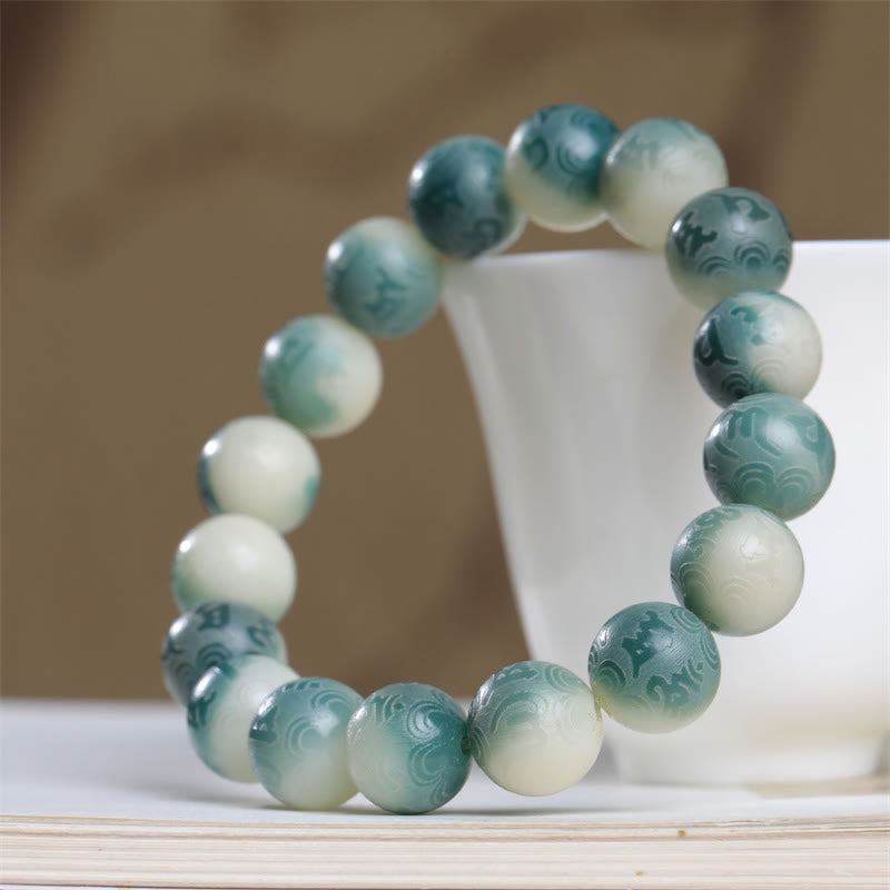 Bodhi Seed Om Mani Padme Hum Bracelet – Complete circular loop on ceramic stand, carved Bodhi seed beads