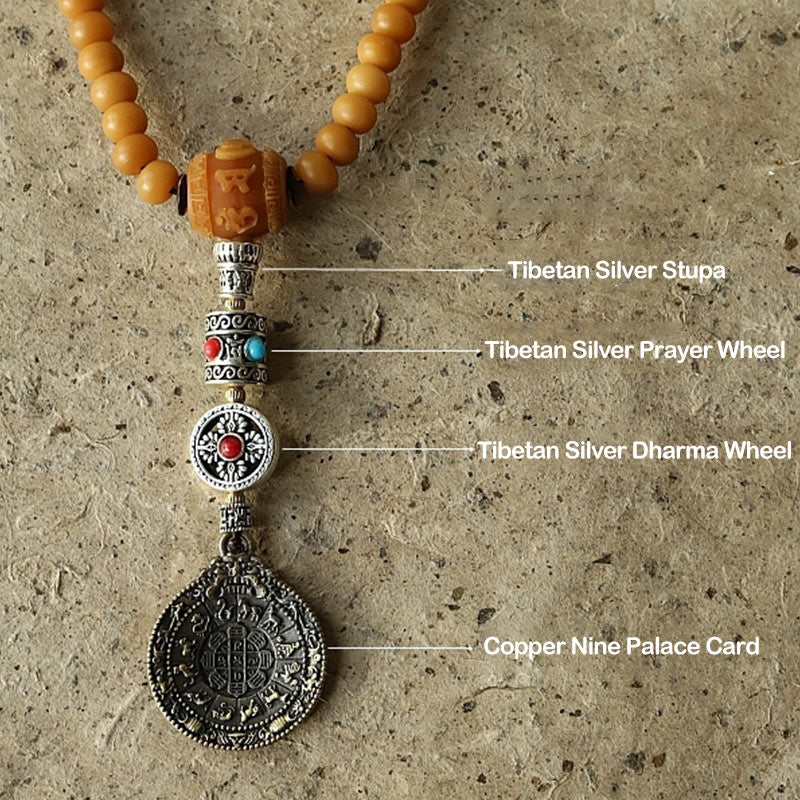 108 Bodhi Seed Mala Bracelet – Close-up mala components: stupa, prayer wheel, and Bagua pendant