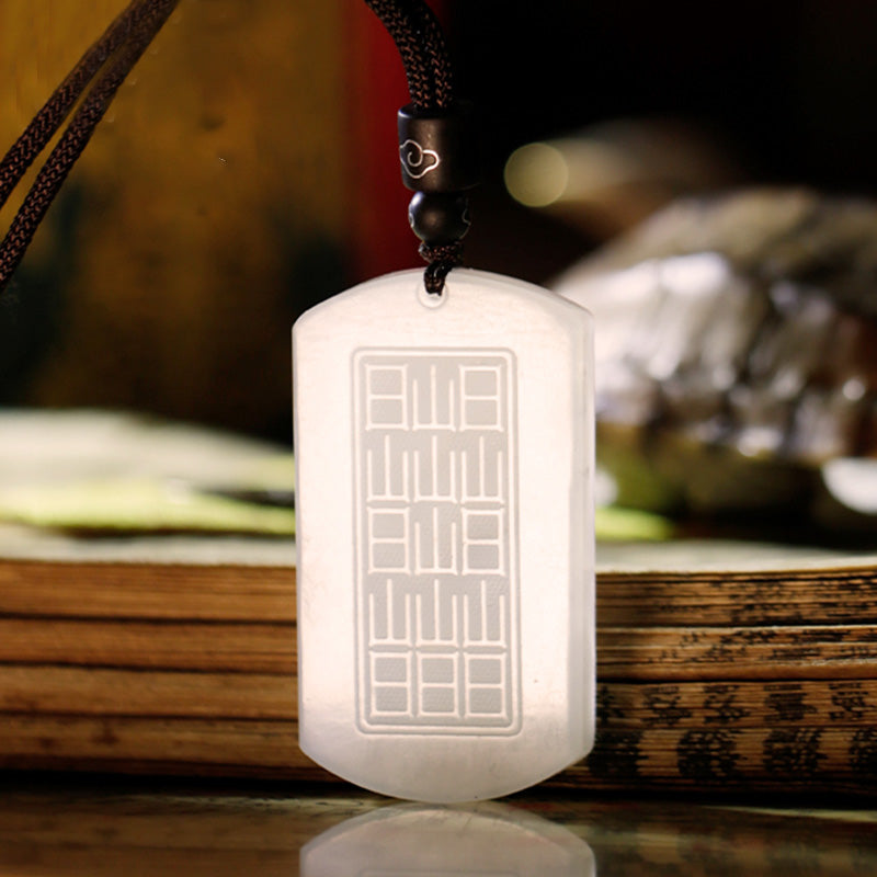White Jade PiXiu Pendant – Back of white jade pendant showing engraved bagua trigram on bamboo books