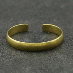 Om Mani Padme Hum Dragon Phoenix Bracelet - Antique brass open cuff bangle on gray stone, matte vintage finish, Mindfulness