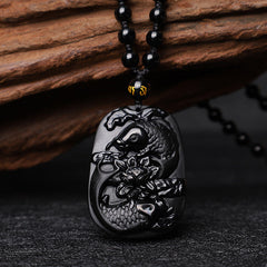 Black Obsidian Koi Fish Lotus Beaded Necklace – close-up of koi fish carving detail, glossy black stone pendant