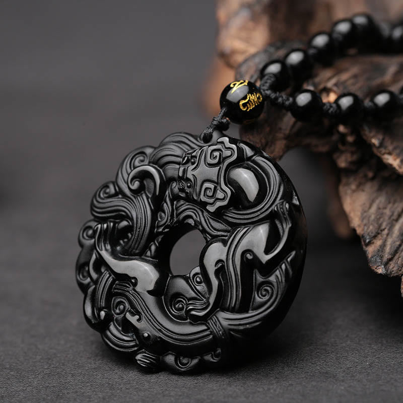 Black Obsidian Pixiu Pendant – Close-up of carved obsidian peace buckle with Pixiu, bead necklace
