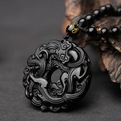 Black Obsidian Pixiu Pendant – Close-up of carved obsidian peace buckle with Pixiu, bead necklace