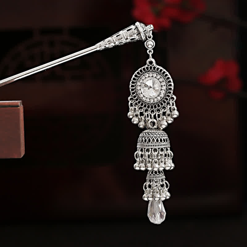 Bell variant silver hairpin with round filigree crystal and bell tassel