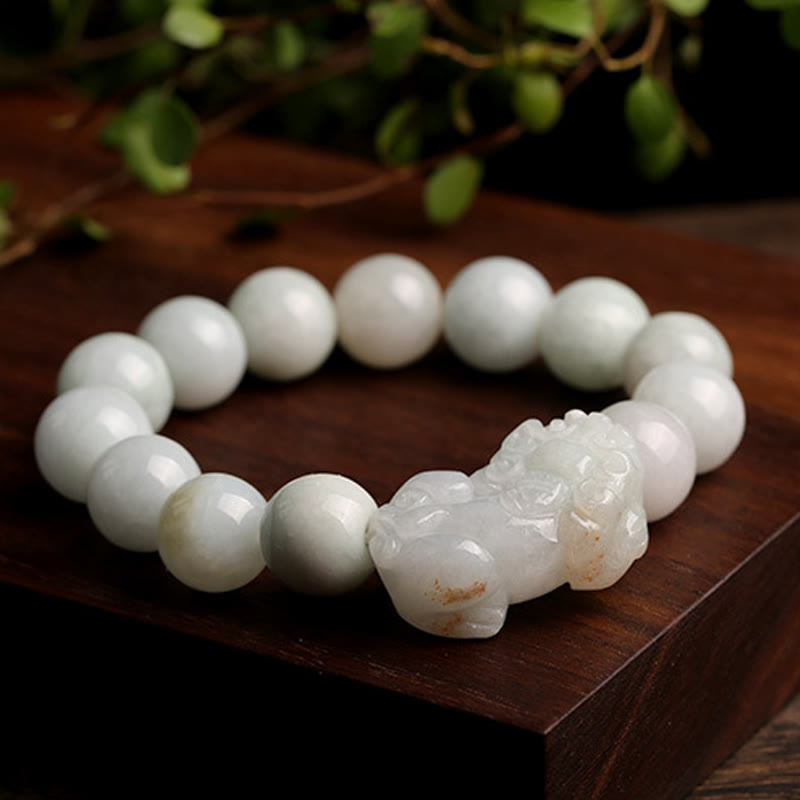 Jade PiXiu Bracelet – On wooden block with green background, studio shot, wealth good luck bracelet