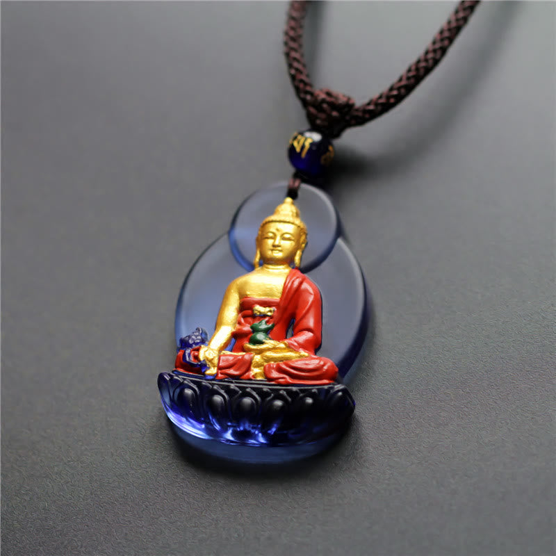 Liuli Crystal Medicine Buddha Pendant – front view with braided cord and bead on gray background, studio shot