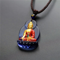 Liuli Crystal Medicine Buddha Pendant – front view with braided cord and bead on gray background, studio shot