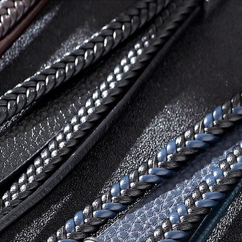 Evil Eye Tiger Eye Bracelet – Black and blue braided leather bracelet macro detail, dark textured bg