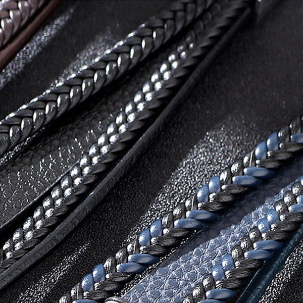 Evil Eye Tiger Eye Bracelet – Black and blue braided leather bracelet macro detail, dark textured bg