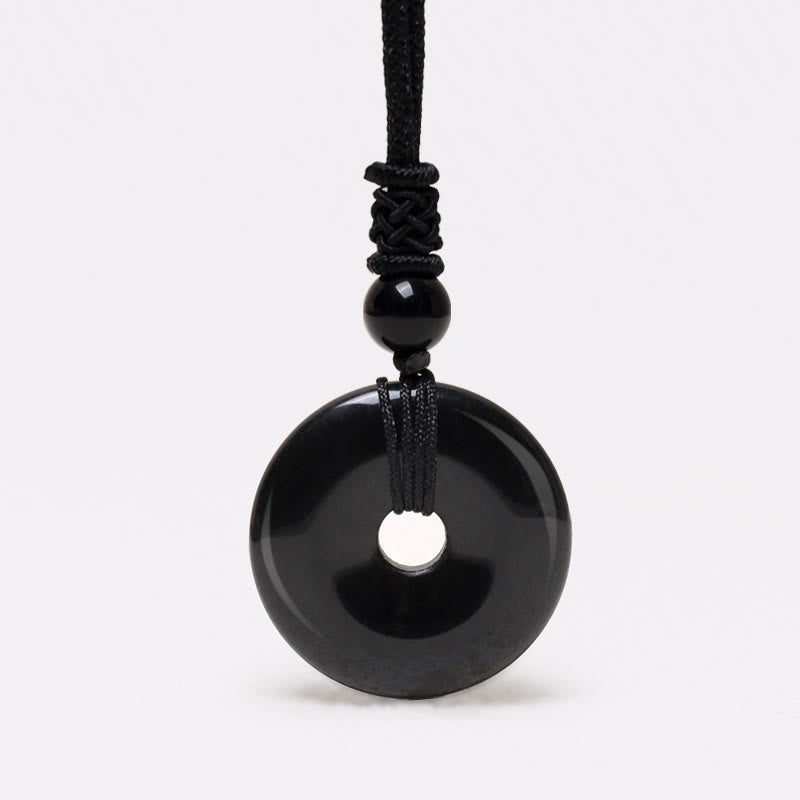 Lucky Coin Pendant Healing Crystal Gemstone Necklace – Glossy black obsidian bi disc pendant on black braided cord