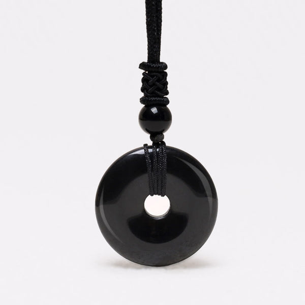 Lucky Coin Pendant Healing Crystal Gemstone Necklace – Glossy black obsidian bi disc pendant on black braided cord