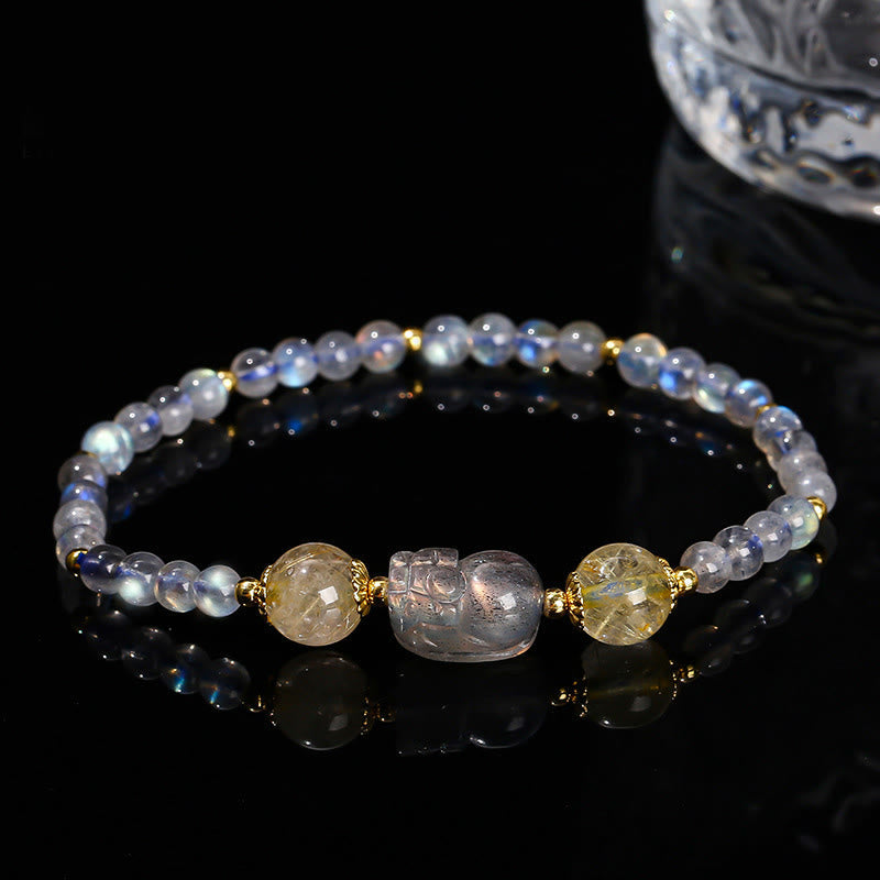Moonstone Strawberry Quartz Tourmaline Bracelet – Moonstone beads with gold spacers and clear PiXiu on black, healing jewelry