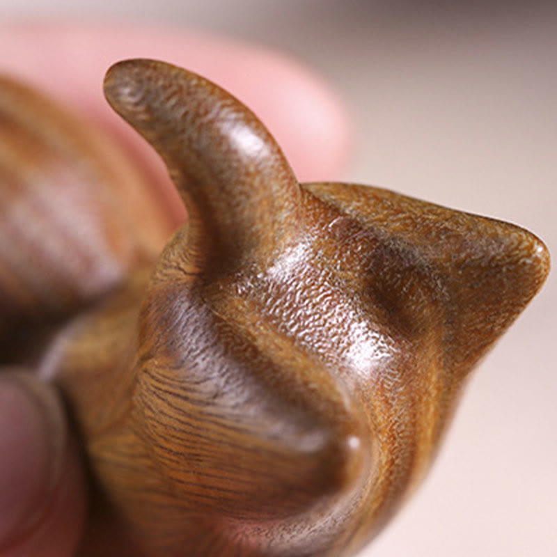 Green Sandalwood Cat Incense Burner - Macro detail with finger for size reference