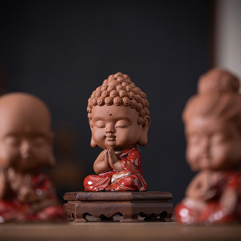 Gautama Kwan Yin Ceramic Set – figures arranged in triangle formation on desk, balanced feng shui