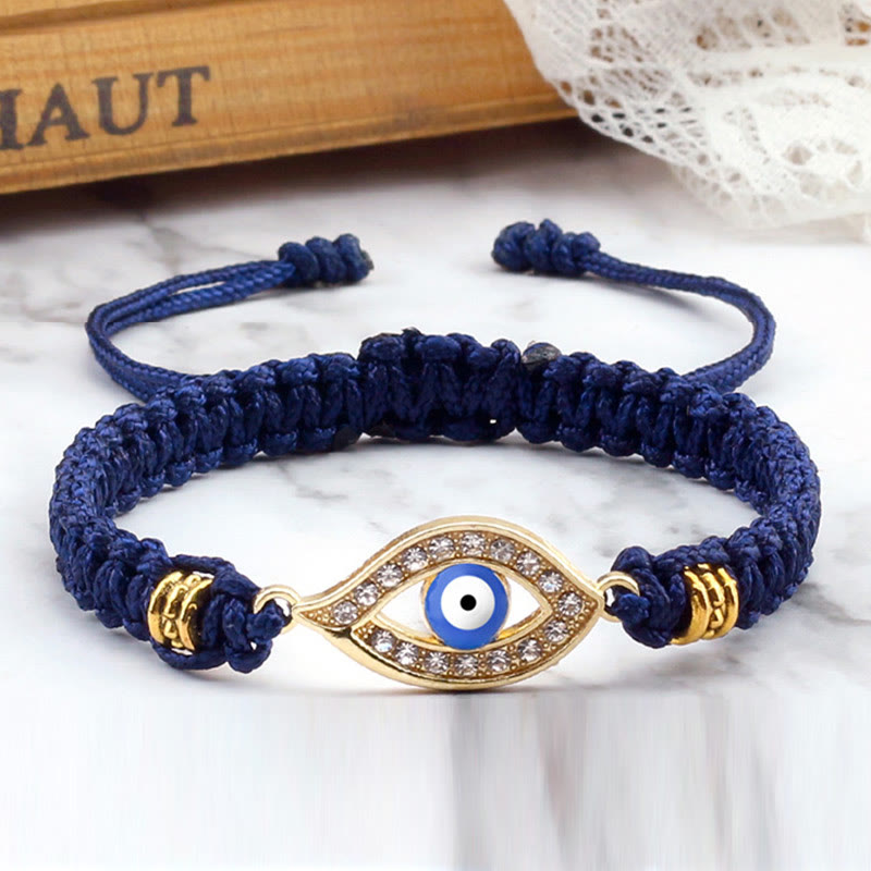 Navy blue cord evil eye bracelet with gold evil eye crystal pave charm, marble styling