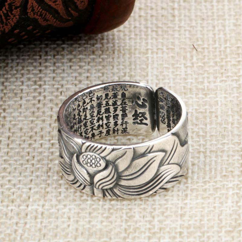 999 Silver Lotus Ring – Heart Sutra text on inner band over linen, wood prop