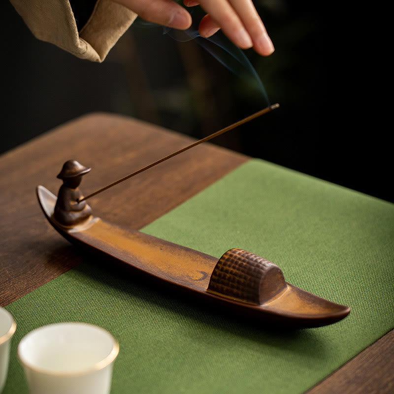 Lonely Fisherman Incense Burner – Boat with incense on green mat and tea cups, hand placing, zen