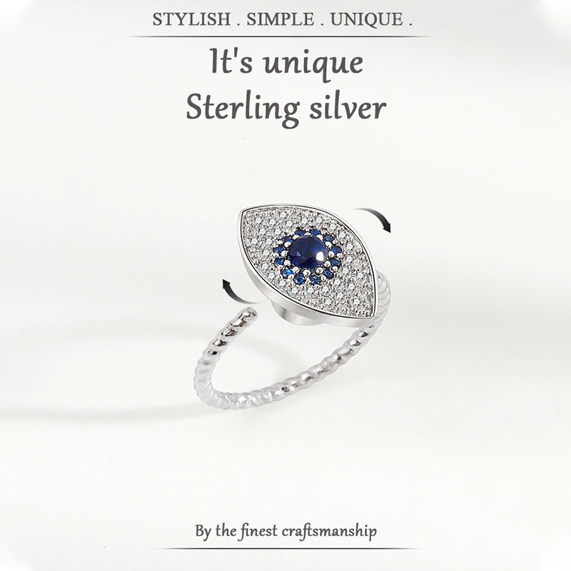 Evil Eye Rotatable Ring – Silver adjustable evil eye ring with blue sapphire, two-angle detail view