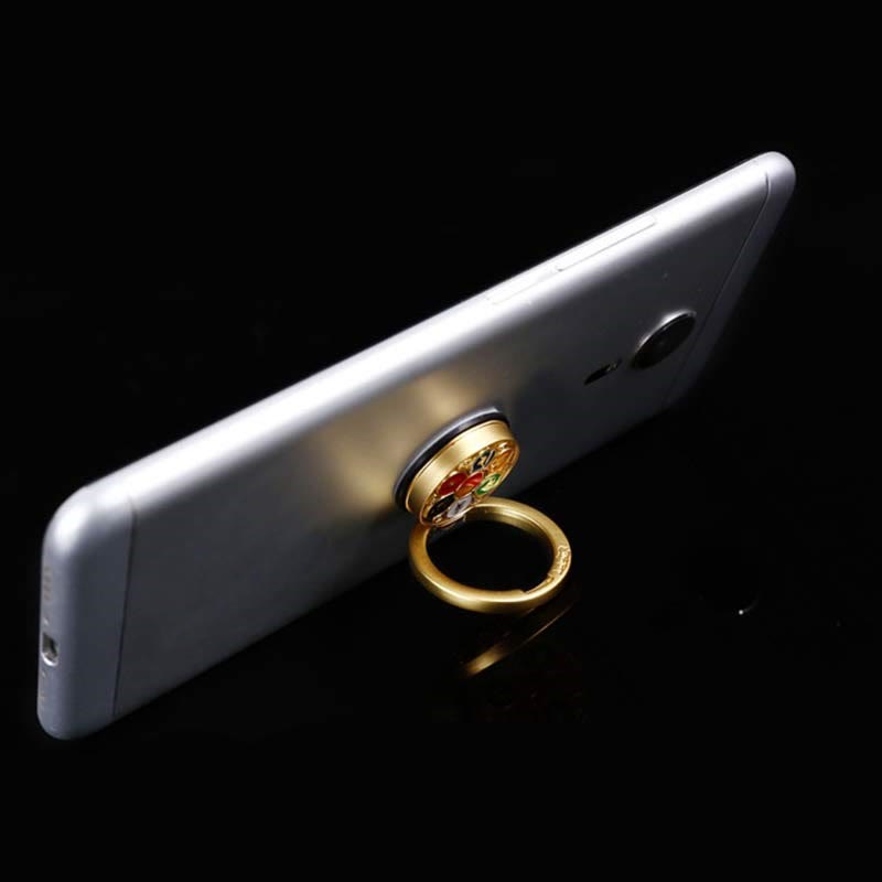 Om Mani Padme Hum Phone Ring Holder – Gold enamel ring as phone kickstand on silver phone, phone stand
