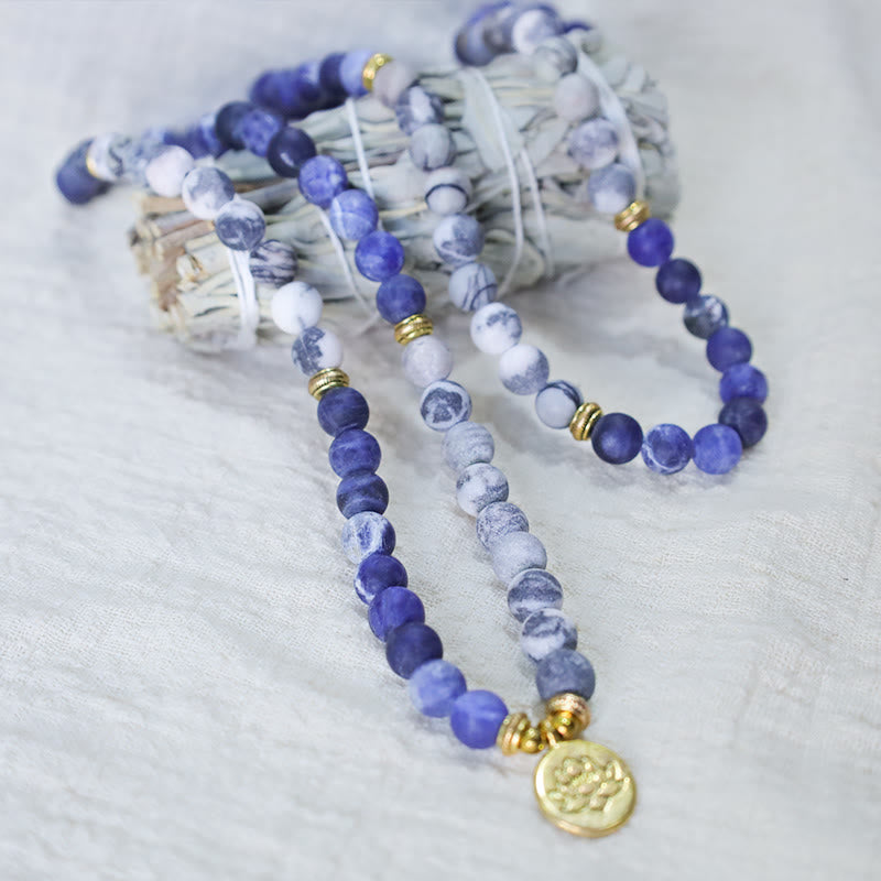Picasso Jasper Mala – blue and white stone necklace draped with sage bundle, jasper