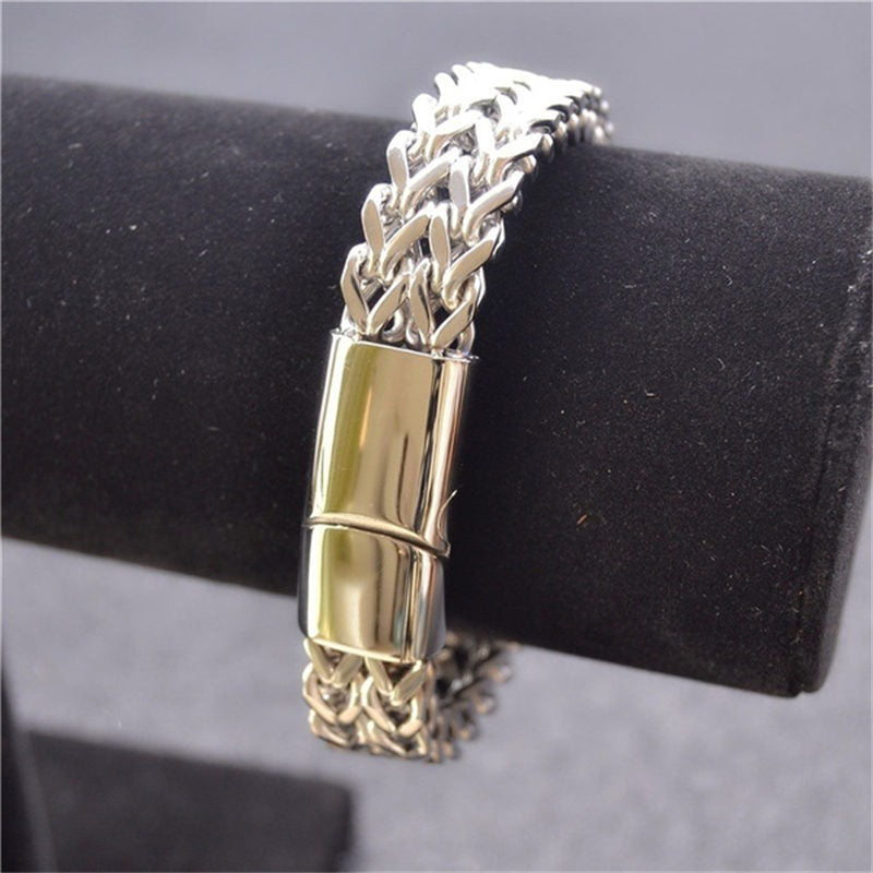 Fish Scale Titanium Steel Magnetic Bracelet – silver chain on black velvet jewelry stand, gold accent clasp, neutral background