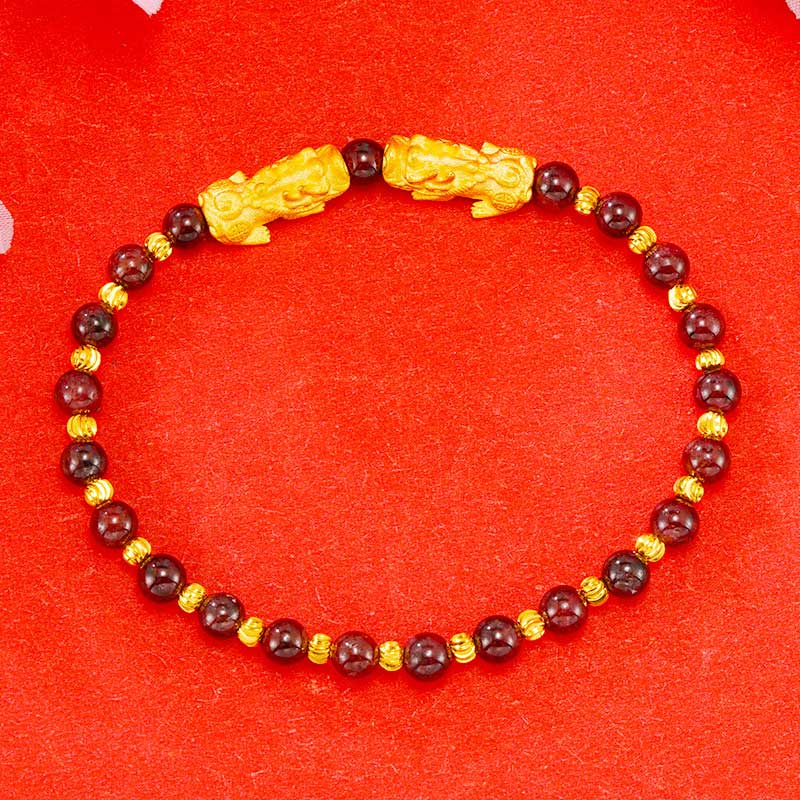 Golden Double PiXiu Bracelet – Dark red garnet beads with gold PiXiu pair and spacers on red, prosperity