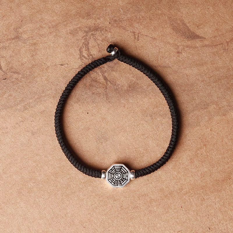 925 Sterling Silver Yin Yang Bagua Cinnabar Bracelet – Black braided cord with Bagua charm, adjustable knot on kraft paper