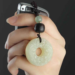 Jade PiXiu Peace Buckle Abundance Key Chain – Hand holding car key with jade peace buckle charm close-up, luxury