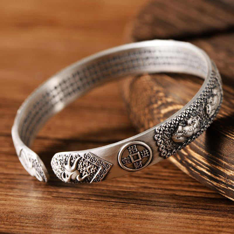 Tibetan PiXiu Heart Sutra Coin White Copper Wealth Bracelet – reverse side with lucky symbols on wood, prosperity charm