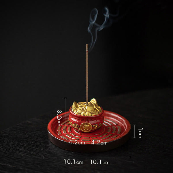 Red Gold Incense Burner – Vermilion fortune bowl with gold accents on calligraphy scroll, tea ceremony setting