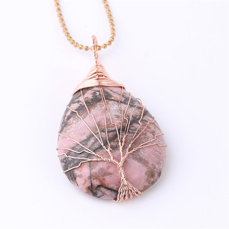 Quartz Crystal Tree of Life Necklace – rhodonite pink marbled pendant, rose gold wire tree, white background