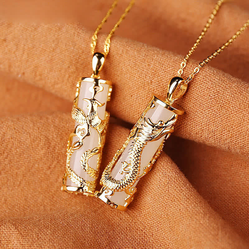 Jade Dragon Phoenix Copper Pendant – Dragon and phoenix gold pendants on box chains, terracotta backdrop, blessed