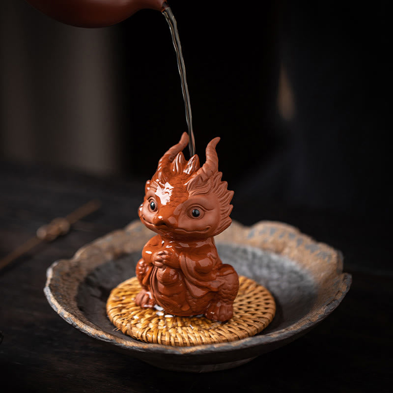 Luck Dragon Purple Clay Tea Pet - tea pouring over dragon, ceremonial nourishment ritual