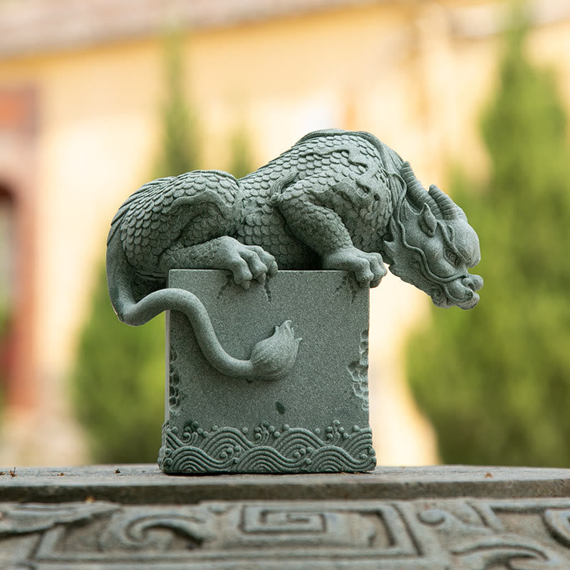 Feng Shui Dragon Sandstone Statue dragon on stone base, warm outdoor bokeh, three-quarter view, watchful