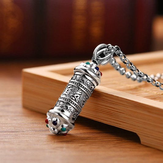 Om Mani Padme Hum Silver Necklace - Side angle of cylindrical mantra pendant with gemstone caps, Tibetan necklace
