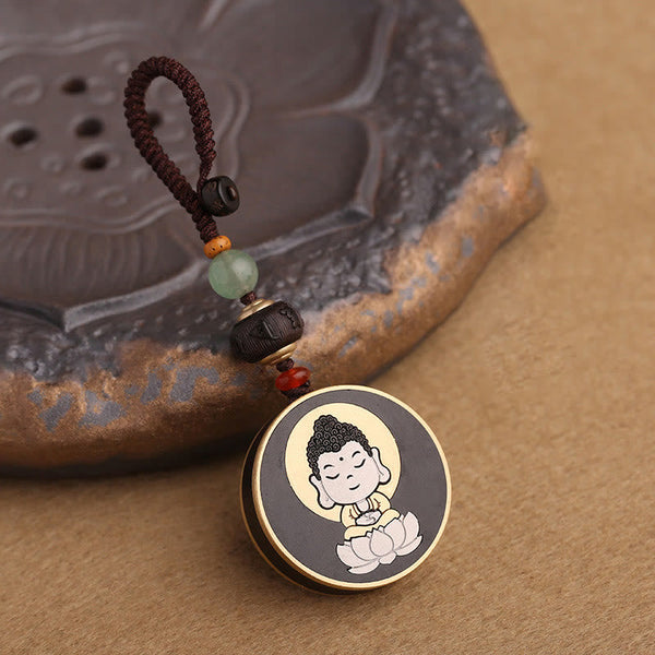 Ebony Avalokitesvara Keychain – close-up of compassionate face with closed eyes and crown, icon detail