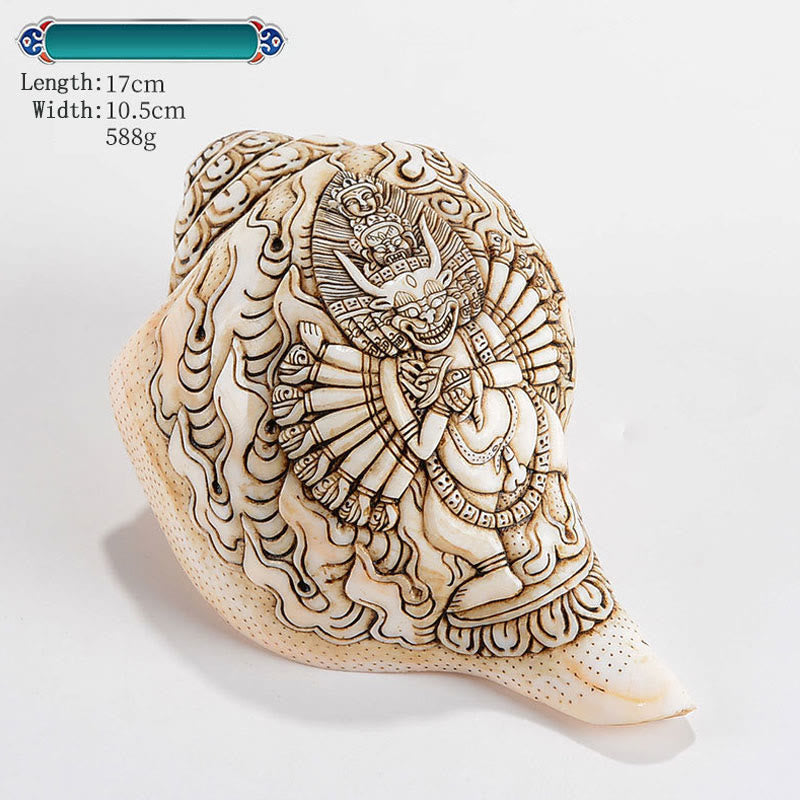 Engraved Shankha Wealth Conch – warm tungsten light on carved deity face, evening meditation ambiance