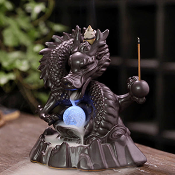 Dragon Backflow Burner – Blue illuminated orb with smoke cascade, peaceful
