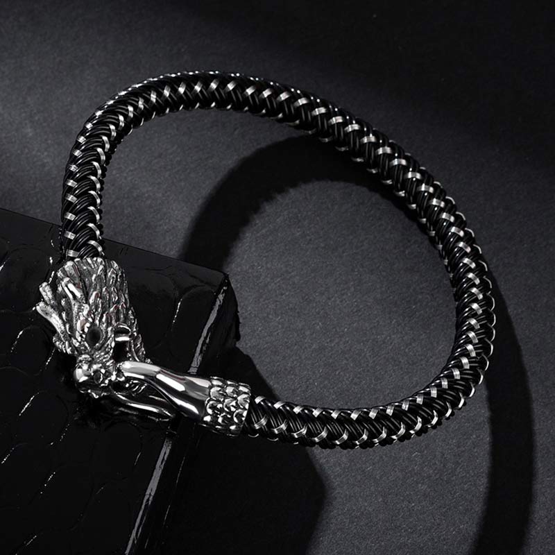 Dragon Protection Bracelet - Braided band resting on black pedestal, Bold