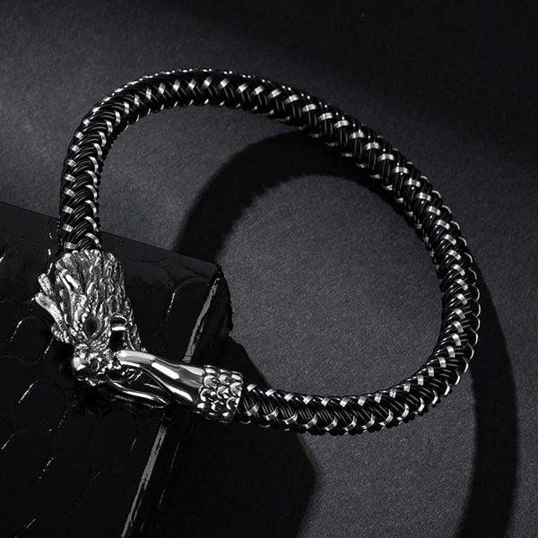 Dragon Protection Bracelet - Braided band resting on black pedestal, Bold