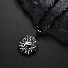 Bagua Yin Yang Titanium Steel Pendant - Black Bagua yin-yang medallion on dark stone, titanium steel jewelry