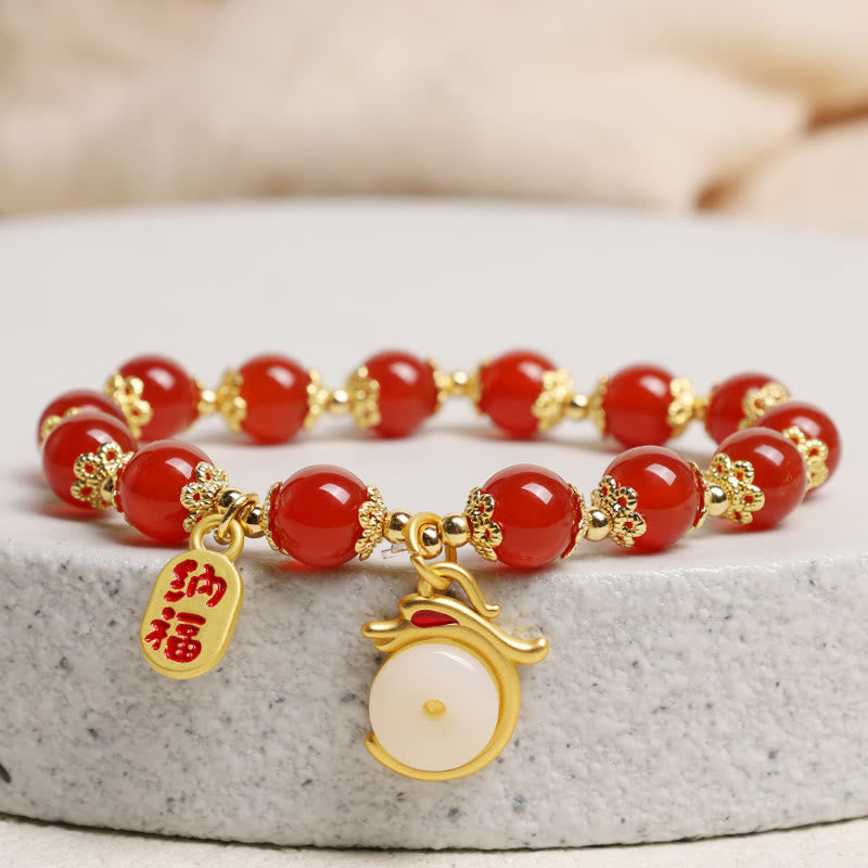 Red Agate Aventurine Dragon Bracelet – Red bead bracelet on stone pedestal with gold fortune charms, Prosperous