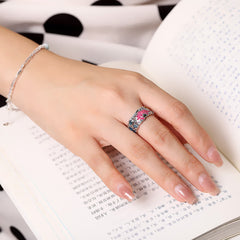 Sterling Silver Lotus Koi Ring - Worn on hand showing pink center stone and blue accents, statement ring