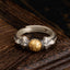 Manjusri Mantra Ring – Adjustable silver band with gold mantra bead on dark wood, sterling silver Buddhist ring