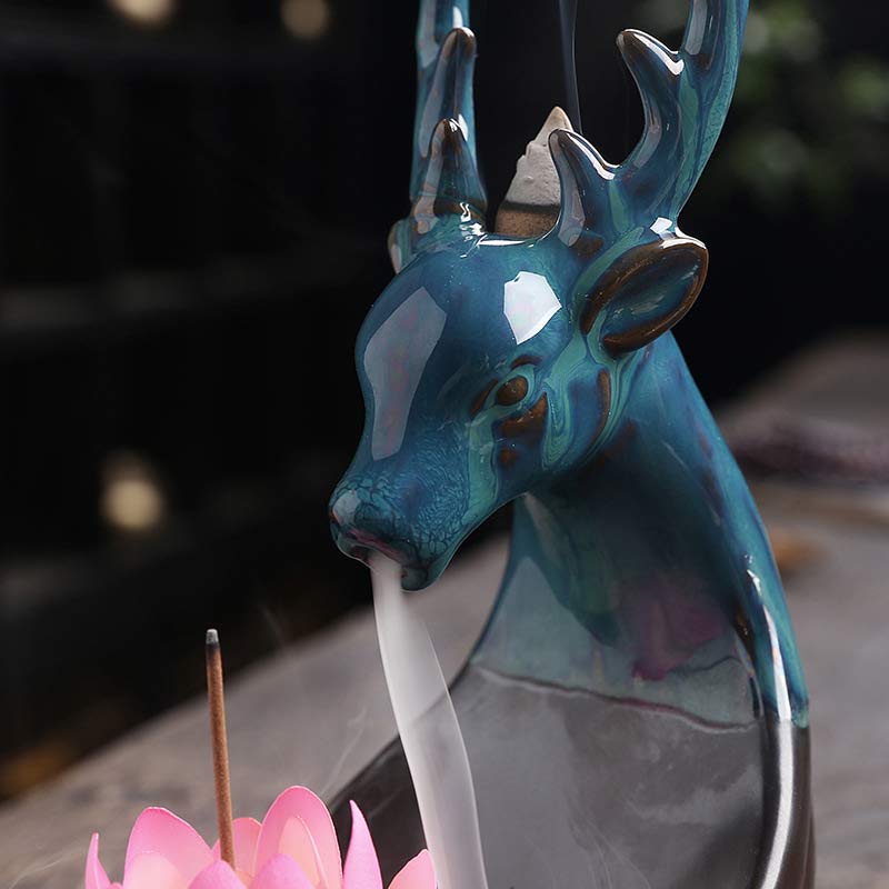 Little Deer Ceramic Lotus Incense Burner – Close-up deer face with iridescent turquoise glaze and white smoke from mouth